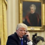 Trump posing with picture of Andrew Jackson